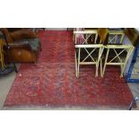 A large red ground Turkoman Tekke carpet, with symmetrical pattern, 270cm x 200cm