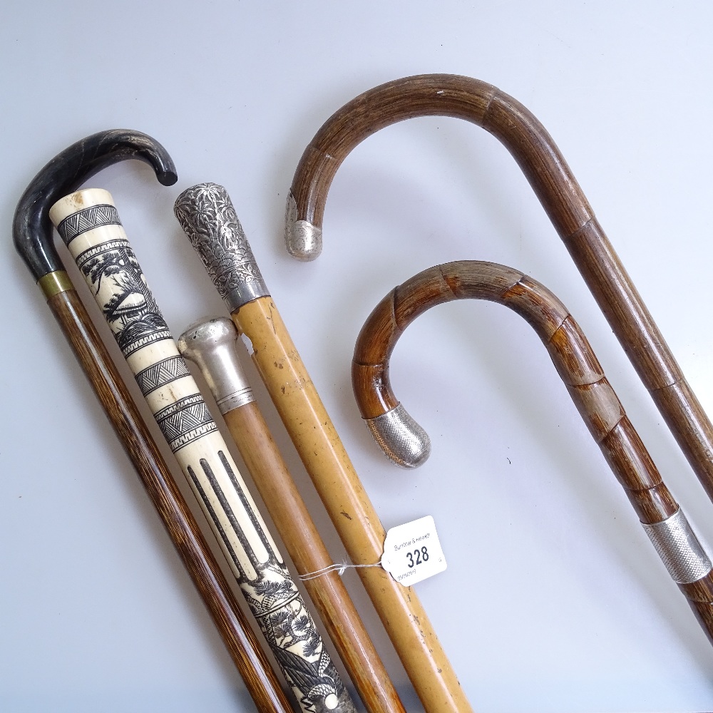 Various walking sticks, including silver tops