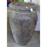 A textured terracotta garden pot, H84cm