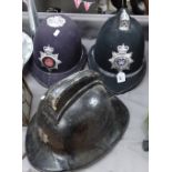 A Vintage Welsh fireman's helmet, and 2 Welsh policeman's helmets