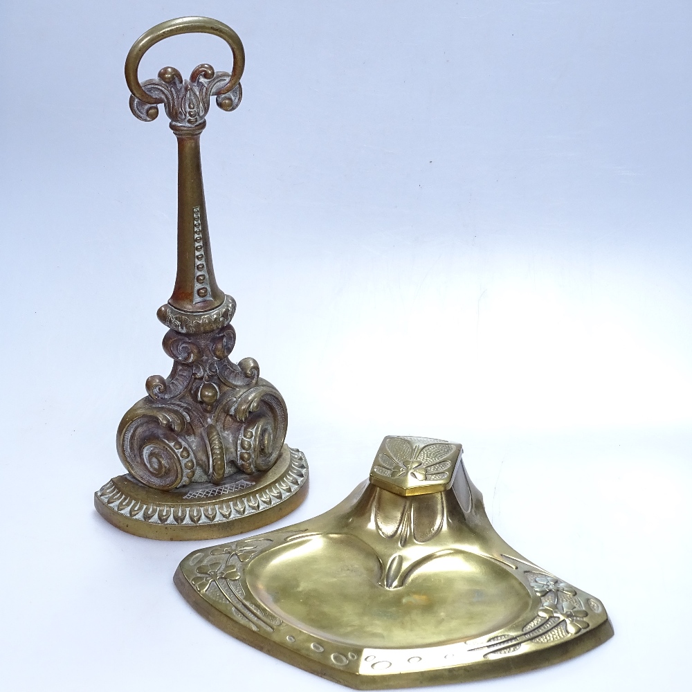 An Antique cast-brass doorstop, 13.5", and an Art Nouveau desk stand with clover leaf design