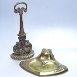 An Antique cast-brass doorstop, 13.5", and an Art Nouveau desk stand with clover leaf design