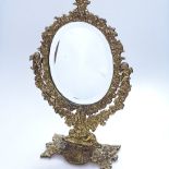 A cast-brass framed bevelled glass swing toilet mirror, height 16.5"