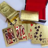 Cased 999.9 gold playing cards depicting $100 bills