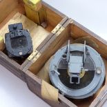 A gimballed pine-cased military compass, and a small Pioneer compass