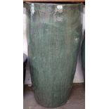 A large green glazed terracotta plant pot, H100cm