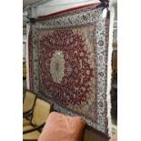 A red ground Keshan carpet, 200cm x 140cm