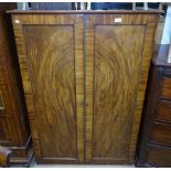A Victorian flame-veneered mahogany office cabinet, with 2 panelled doors and sliding shelf