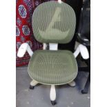 A white designer office chair with green mesh seat and back, fully adjustable