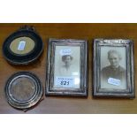 A pair of rectangular silver-fronted photo frames, and 2 circular silver-fronted photo frames