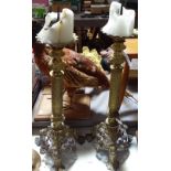 A pair of French gilt-metal pricket church candlesticks on cast tripod supports, height 23" overall