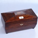 A 19th century rosewood sarcophagus tea caddy with inlaid shell motif