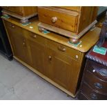 An Ercol sideboard, with 3 frieze drawers, and cupboards under, W120cm