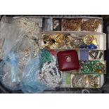 A tray of mixed costume jewellery, pearl necklaces etc