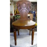 A Victorian oak shield-back hall chair