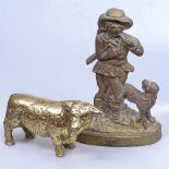 A brass figure doorstop, 12.5", and a brass bull
