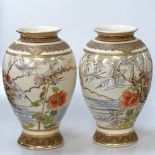 A pair of Japanese Satsuma vases, with designs of cranes and blossoms, height 12"