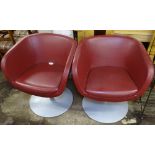 A pair of swivel Club chairs