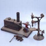 A stationary steam engine, length 10.5", a watchmaker's vice, and another tool