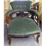 An Edwardian button-back upholstered bow-arm tub chair