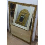 A gilt-gesso framed bevelled-edge wall mirror, W75cm, L98cm
