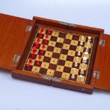 A mahogany-cased travelling folding chess set, missing 1 piece