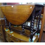 An oak oval barley twist gateleg table