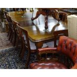 A Victorian mahogany wind-out dining table, with 2 spare leafs, having moulded edge, raised on