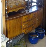 An Edwardian mahogany bow-front sideboard, with fitted drawers and cupboards, on square legs, L153cm