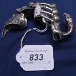 An unusual sterling silver finger ring, in the form of a mythical reptile