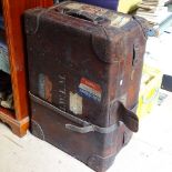 A large Vintage leather travel trunk with labels, length 30.5"