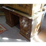 A 19th century mahogany writing desk, with a green leather skiver, and fitted drawers, on plinth