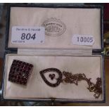 A garnet heart-shaped pendant and chain, together with a garnet curved square brooch (2)