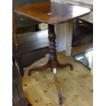 A George III mahogany tilt-top table on pirouette base