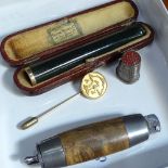 A Swedish barrel knife, gold and jadeite cheroot holder, thimble, and a silver tie pin