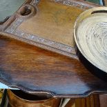 An Edwardian tray with gadrooned edge, length 22", a carved Eastern tray and another