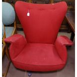 A mid-century tilt and swivel Italian design lounge chair, with later upholstery