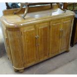 An Art Deco oak sideboard, possibly by Heal's, with fitted panelled cupboards and chrome-mounted