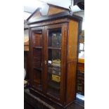 An Edwardian mahogany and satinwood-banded hanging display cabinet, with 2 bevelled glazed doors,