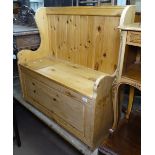 A modern polished pine hall settle, W102cm