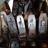 A boxful of carpenter's woodworking planes, including Stanley