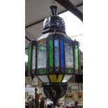 A Moroccan style ceiling lantern with coloured glass panels, height 28" approx