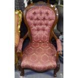 A Victorian rosewood-framed open armchair, with button-back upholstery