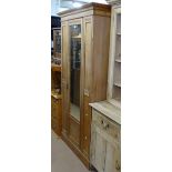 An Edwardian satin-walnut single mirror door wardrobe, W94cm