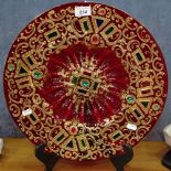 A large decorative ruby glass dish, with inset stones and gilded decoration, 16"
