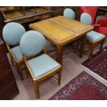 An Art Deco oak draw leaf dining table, with 4 matching upholstered chairs, possibly Heal's