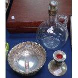A glass decanter with silver-mounted stopper, a small silver candlestick, 2 silver thimbles, and