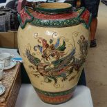 An Oriental incised and painted vase with dragon decoration, 16.5"