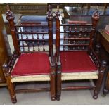 A pair of Indian wedding chairs, with spindle-turned decoration and rush seats