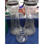 A pair of tall cut-glass silver-mounted vases, and a similar smaller vase